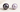Purple Tahitian pearl beside a lavender freshwater pearl showing the difference between dark overtone and soft body color.