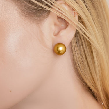 10-11mm Golden South Sea pearl stud earrings worn on ear