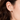 5.5–6.0mm White Akoya Pearl Stud Earrings shown in a close-up ear view, featuring a petite round pearl with bright luster.