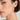 Model wearing 9-10mm white South Sea round pearl stud earrings.