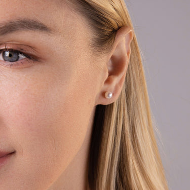 Close-up of 5.5-6mm white freshwater pearl stud earrings