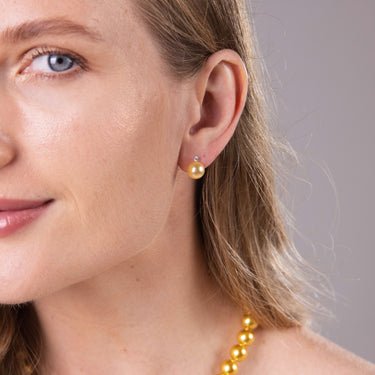 Close-up of 8-8.5mm golden South Sea pearl earrings