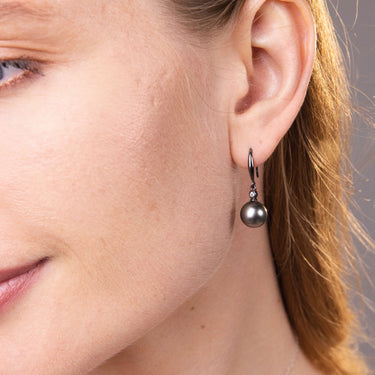 Close-up of Black Tahitian Pearl Zirconia Fish Hook Earrings