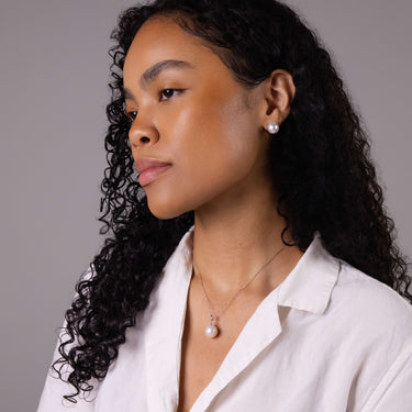Model wearing 11-12mm White South Sea Pearl Stud Earrings