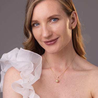 Model wearing 8-9mm Golden South Sea pearl stud earrings