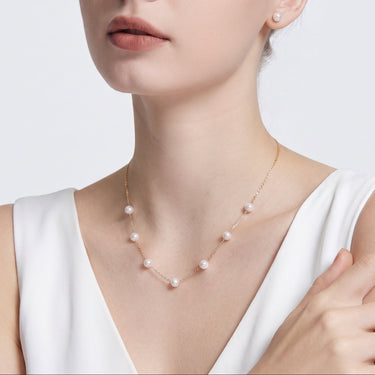 Model wearing a white Japanese Akoya Pearl Tincup Necklace