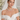 Model wearing triple strand white Akoya pearl necklace