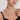 close-up of triple strand white Akoya pearl necklace