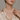 close-up of triple strand white freshwater pearl necklace