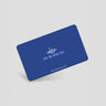 Blue gift card with 'DE BLANCAS' branding on a light gray background